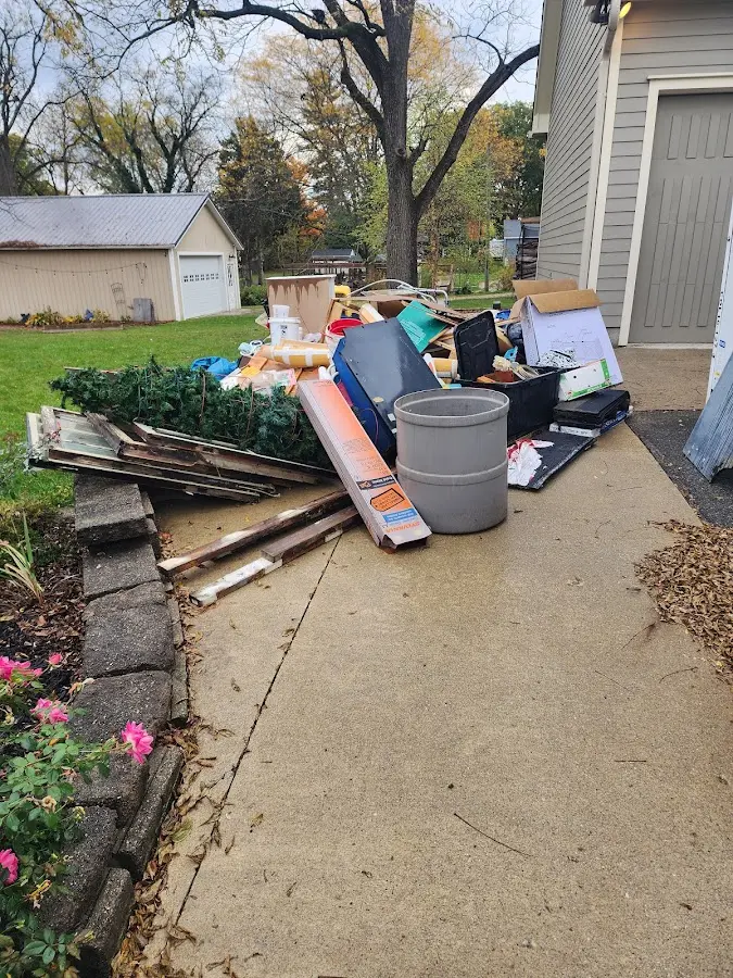 Dumpster being loaded with debris for 12 Yard Dumpster Rental in Oceano